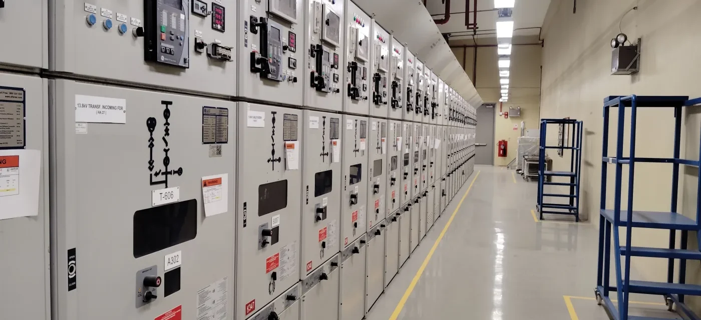 Electrical panels in an industrial control room; Pexels photo by Shameer Vayalakkad Hydrose.