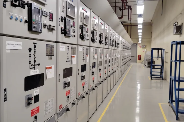 Electrical panels in an industrial control room; Pexels photo by Shameer Vayalakkad Hydrose.