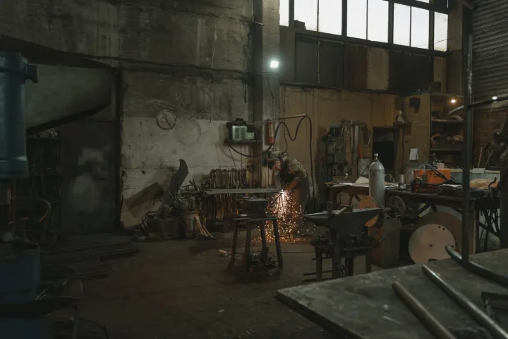 Industrial welder working on a metal component; Pexels photo by Tima Miroshnichenko.