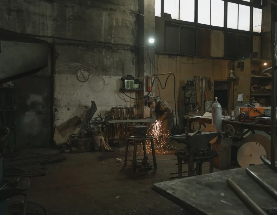 Industrial welder working on a metal component; Pexels photo by Tima Miroshnichenko.