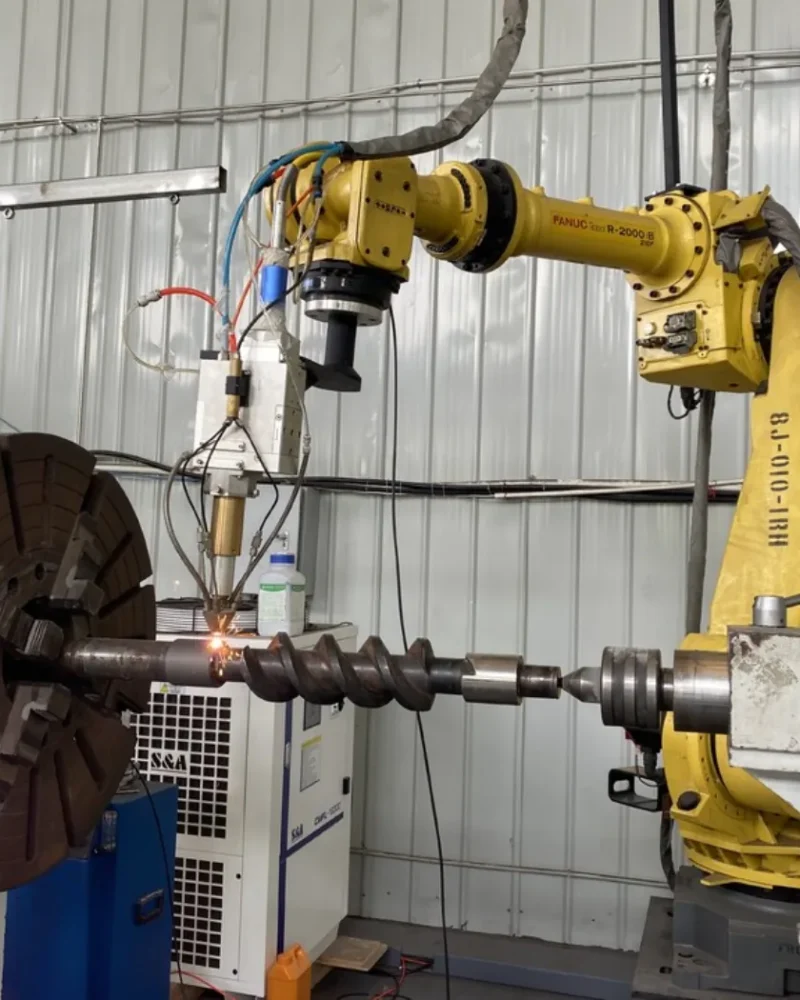 Robotic cladding work cell; image supplied in the Robotic Cladding presentation.