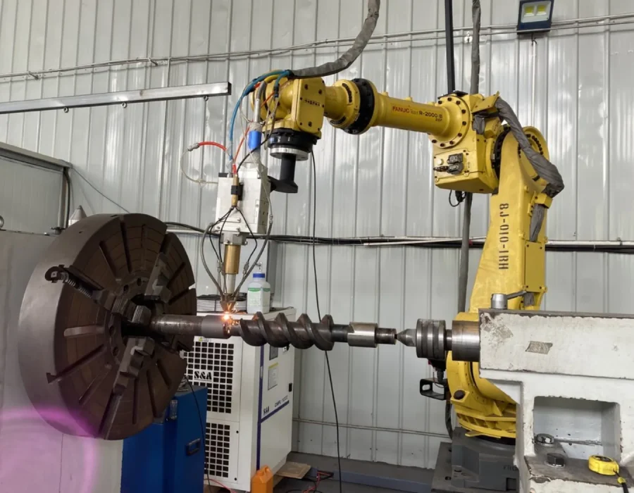 Robotic cladding work cell; image supplied in the Robotic Cladding presentation.