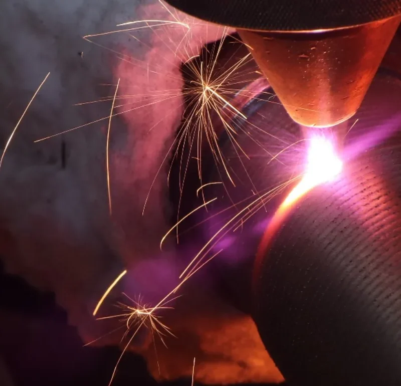 Robotic cladding torch working on a metal component; image supplied in the Robotic Cladding presentation.