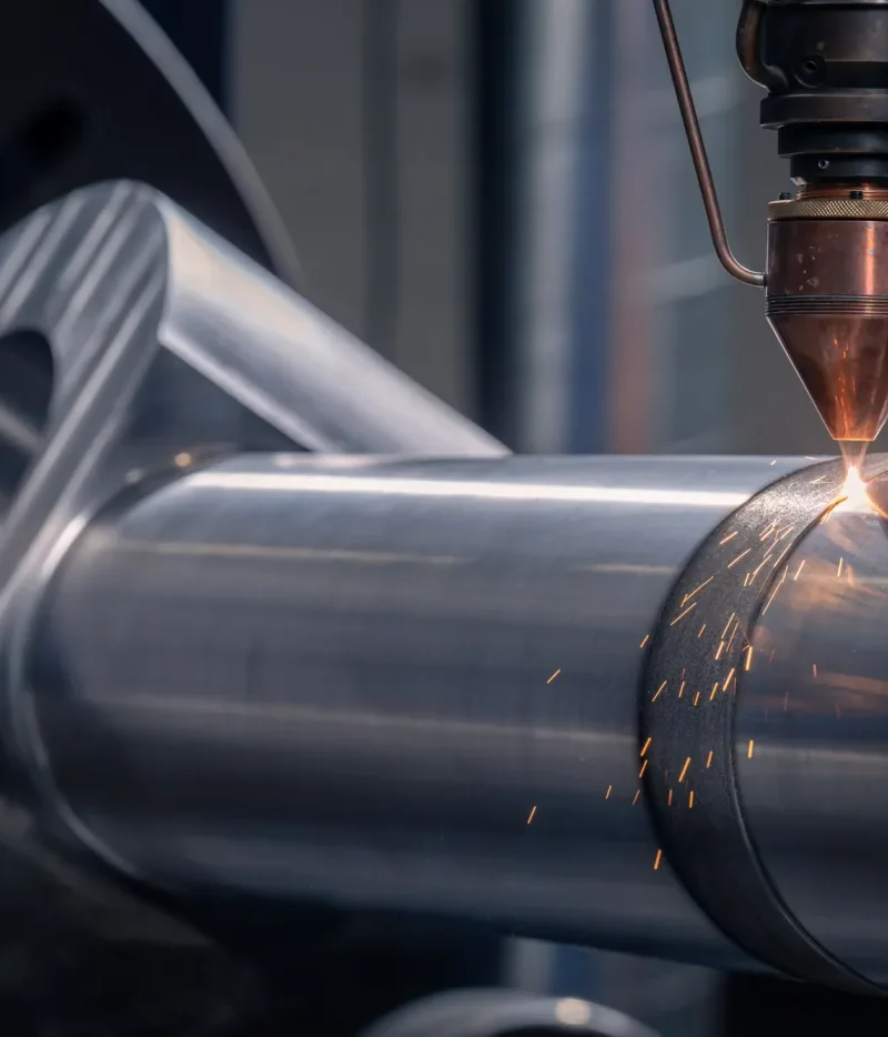 Robotic cladding applied to a cylindrical component; image supplied in the Robotic Cladding presentation.